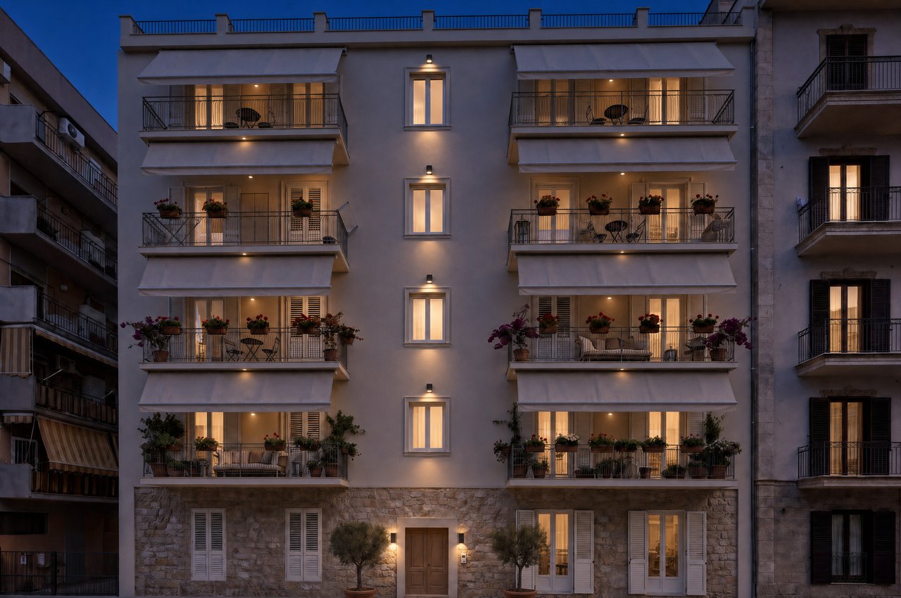Render di progetto della facciata di Lincoln 35 a Porto Empedocle, di sera